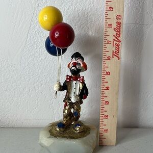 Colorful Clown Sculpture with Balloons